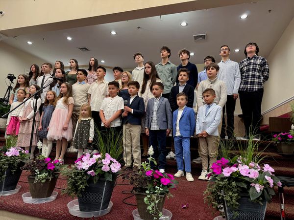 The children's choir standing together on stage on Easter Sunday